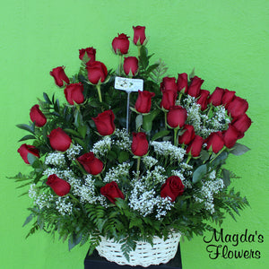 Loves Embrace This elegant floral arrangement is the perfect way to express your love and affection. It features a charming heart arrangement of deeo red roses, surrounded by lush greenery on a lovely basket. This combination creates a captivating design that will make an impression on your special someone. 