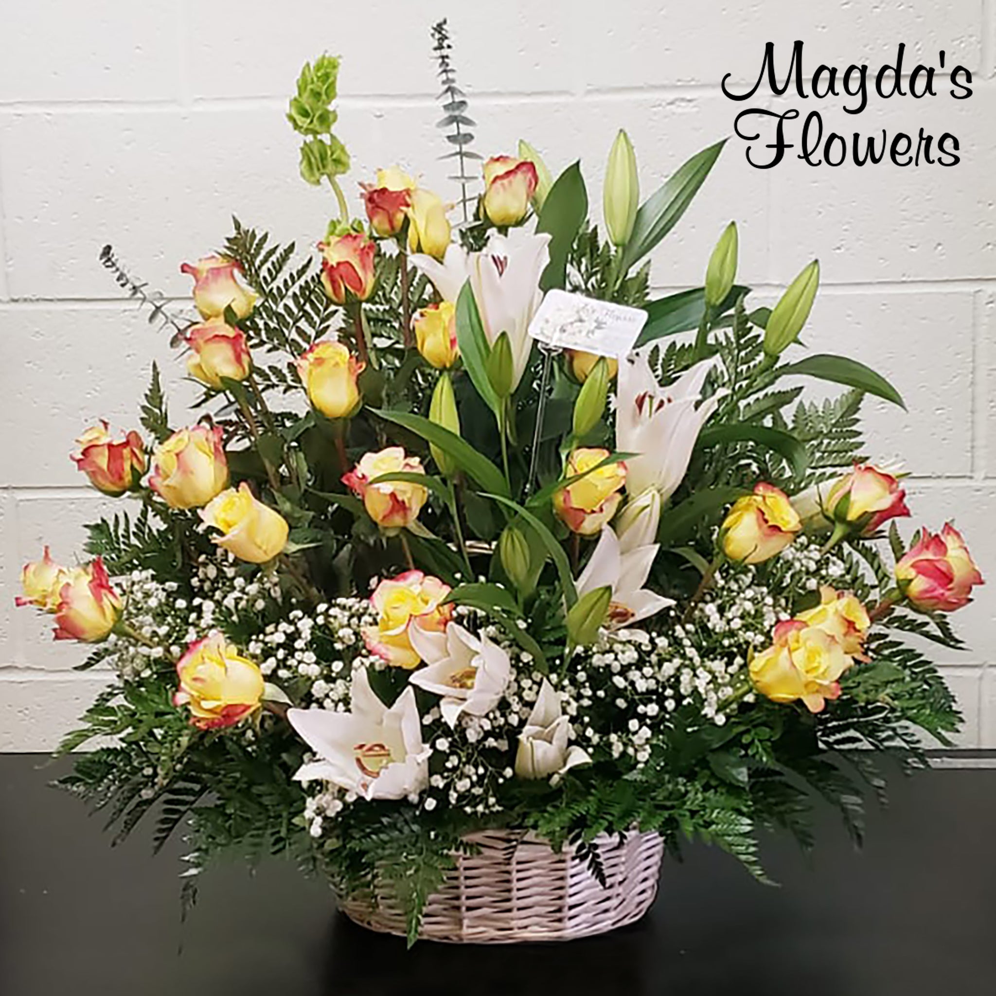 Yellow Rose, lilies, floral basket - Magdas Flowers - Salinas, California. Order flowers online for local delivery.