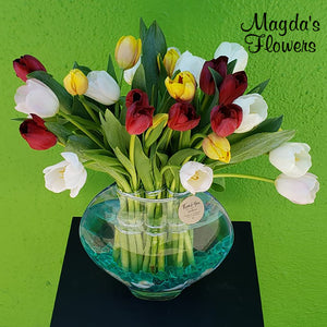 Bright colored tulips in a round vase - Order flowers online from your local florist - Magdas Flowers, Salinas California